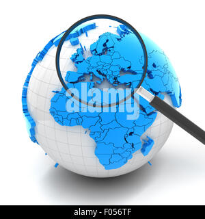 Globe with magnifying glass over Europe Stock Photo