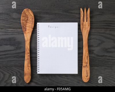 https://l450v.alamy.com/450v/f05amg/simple-blank-notepad-with-word-recipe-on-rustic-wood-table-background-f05amg.jpg