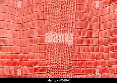 Red crocodile leather, as a background, texture Stock Photo