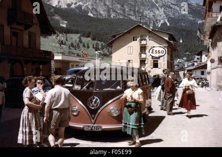 geography / travel,Italy,Cortina d'Ampezzo,street scenes / street scene,tourists in front of a VW bus,circa 1956,20th century,1950s,half length,standing,Volkswagen,VW,box wagon,box wagons,transporter,transporters,bus,buses,busses,Bulli,A 1,travels,travelling,traveling,travel,holiday,vacation,holidays,break,breaks,motor car,auto,passenger car,motorcar,motorcars,autos,passenger cars,cars,car,autocar,automobile,autocars,automobiles,power-driven vehicle,motor vehicle,motor vehicles,driving machine,vehicle,vehicles,tr,Additional-Rights-Clearences-Not Available Stock Photo