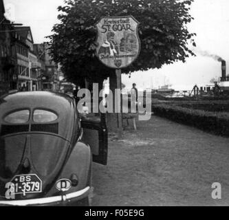 geography / travel,Germany,Rhineland-Palatinate,St. Goar,street scenes / street scene,place-name sign at the Rhine riverbank,1948 - 1956,20th century,1940s,1950s,car,cars,Volkswagen,VW beetle,VW type 1,pathway,path,way,pathways,paths,ways,riversides,riverbanks,river,rivers,Rhine,Rhine Valley,Rhine Gorge,Central Germany,Germany,Central Europe,Europe,40s,50s,travels,travelling,traveling,travel,excursion,outing,short trip,excursions,outings,short trips,Rhineland-Palatinate,Rhineland Palatinate,Rheinland-Pfalz,place-na,Additional-Rights-Clearences-Not Available