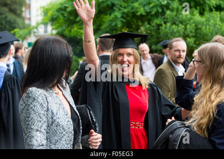 A student from Brighton celebrates graduating near the Brighton Pavilion with family and friends. Stock Photo