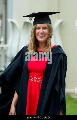 A student from Brighton celebrates graduating near the Brighton Pavilion with family and friends. Stock Photo