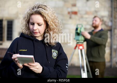 archaeology students with mapping device Stock Photo