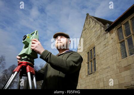 archaeology student with mapping device Stock Photo