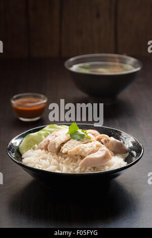 rice steamed with chicken soup or Hainanese Chicken Rice Stock Photo