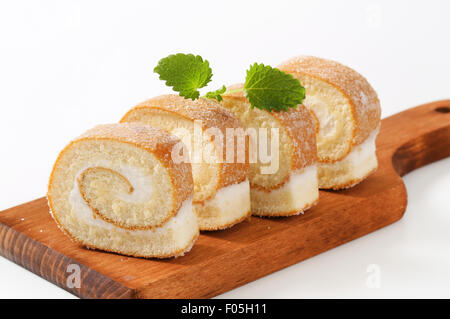 Sponge cake roll with cream filling Stock Photo