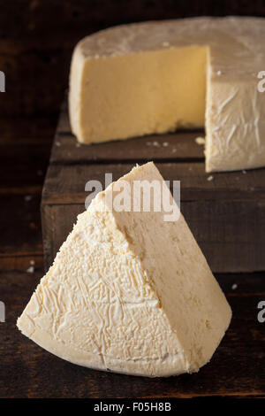 Large Organic White Cheese Wheel Read to Cut Stock Photo