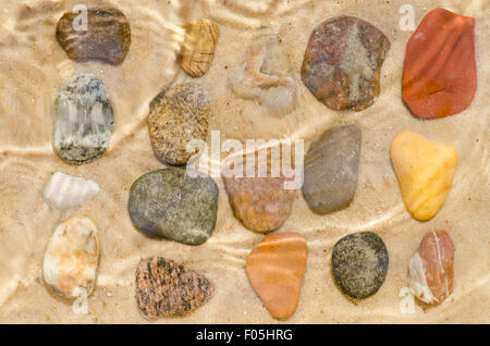 pebbles composition on sand  background Stock Photo