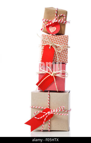 Stack of handcraft red colored gift boxes on white background Stock Photo