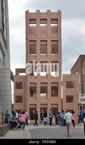 London, UK. 7th Aug, 2015. The People's Tower is a 14 meter high structure build out of cardboard boxes outside the Artsdepot in North Finchley London 7 August 2015. The brainchild of French visual artist Olivier Grossetête. Olivier works in the outdoors with local volunteers and participants using cardboard and recycled materials for his projects. Organized by Circulate a consortium of organizations which developed an outdoor arts network in outer London. Credit:  David Bleeker Photography.com/Alamy Live News Stock Photo