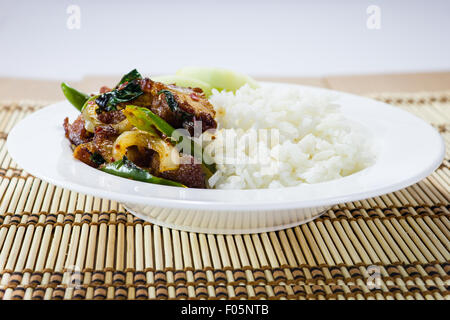 Rice and Stir-fried crispy pork in white dish Stock Photo