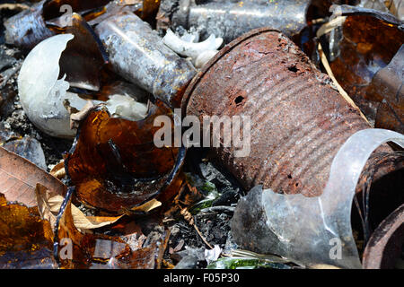 Macro shot of a pile of broken glass and debris that has been burned in a garbage dump Stock Photo