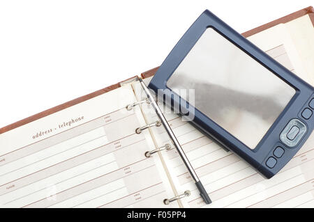 Close up shot of a digital PDA and a address book Stock Photo