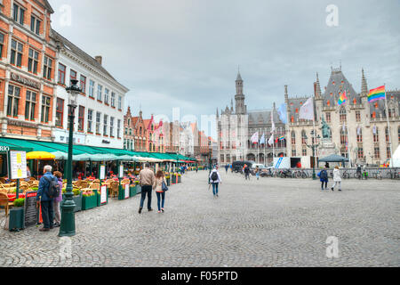 Market square in the city of Bruges in Belgium, showing old buildings and Restaurants Stock Photo