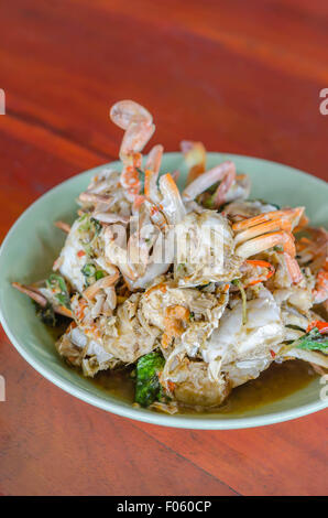 Stir fried Crab with chili & Basil leaves , spicy seafood dish Stock Photo