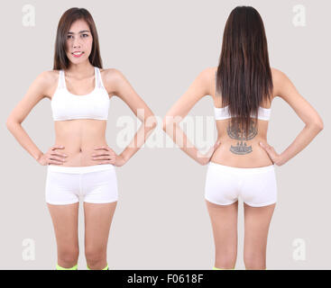 beautiful asian woman in white fitness clothes front and back in studio Stock Photo