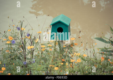 Green Wooden bird houses beside the river. Stock Photo