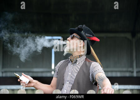 Vapefest DJ Billy Idle take a 'Vape Break' between performances at Uk Vapefest 2015. The former cigarette smoker for over 30 years is now a convert to vaping. Credit:  David Bagnall/Alamy Live News Stock Photo