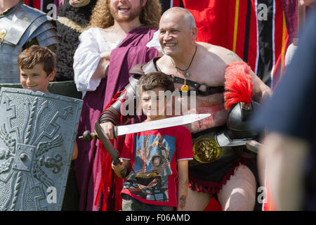 Wallsend, Tyne and Wear, UK. 8th August, 2015. Hadrian Festival at Segedunum Roman Fort: Two young boys pose with Roman Emperor Hadrian and Roman Gladiators. The Hadrian Festival is part of the programme of activities supporting the British Museum's Roman Empire: Power & People exhibition which is on public display 30 May – 13 September 2015 Credit:  Andrew Nicholson/Alamy Live News Stock Photo