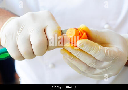 Chef Carving Carrot Stock Photo