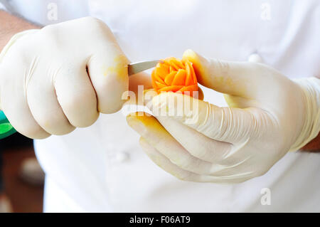 Chef Carving Carrot Stock Photo