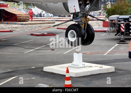 An Airbus plane type A 300 is lifted by a 60-metre-high crane onto a parking area at the airport Cologne-Bonn, Germany, 8 August 2015. The Airbus A300 ZERO-G was used until 2014 by the German national aeronautics and space research centre 'DLR' to test zero gravity, in autumn it will be used as an interactive airplane in the museum. Photo: Horst Galuschka - NO WIRE SERVICE - Stock Photo