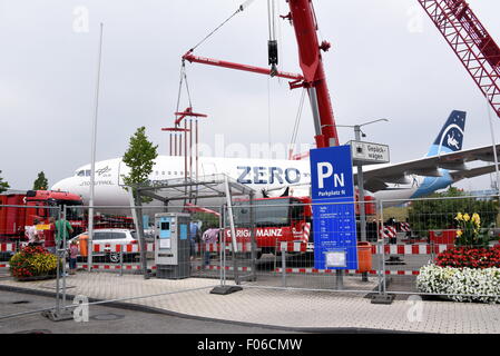 An Airbus plane type A 300 is lifted by a 60-metre-high crane onto a parking area at the airport Cologne-Bonn, Germany, 8 August 2015. The Airbus A300 ZERO-G was used until 2014 by the German national aeronautics and space research centre 'DLR' to test zero gravity, in autumn it will be used as an interactive airplane in the museum. Photo: Horst Galuschka - NO WIRE SERVICE - Stock Photo