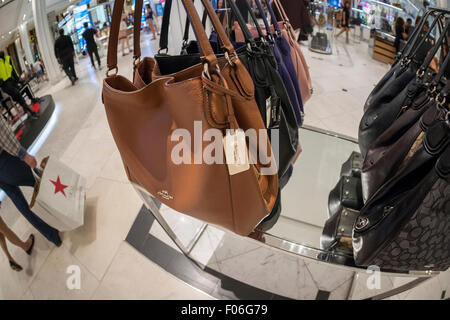 Shoppers browse Michael Kors handbags in the Macy's Herald Square flagship  store on Sunday, March 26, 2017. (Photo by Richard B. Levine) *** Please  Use Credit from Credit Field *** Stock Photo - Alamy