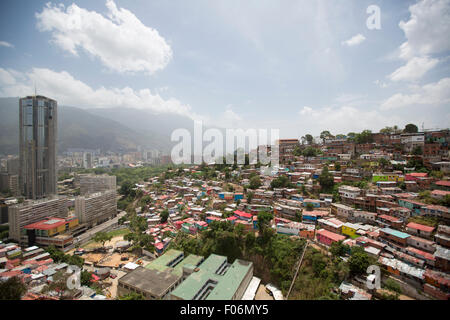 Small wooden colored houses in the poor neighborhood in Caracas. It cover the hills around Caracas and it is dangerous. Stock Photo