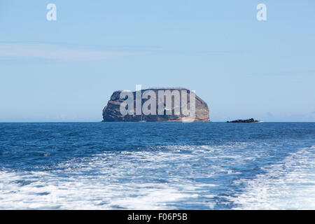 Rock formation in the middle of the Pacific Ocean in the Galapagos Islands against a clear blue sky. Ecuador 2015. Stock Photo