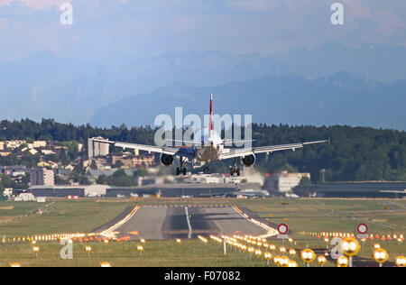 Airplane landing in Zurich airport Stock Photo