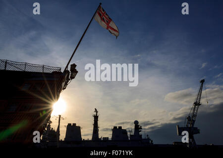 HMS Victory (1778) with the superstructure of HMS Illustrious (1982) in the background at the Historic Dockyard, Portsmouth Stock Photo