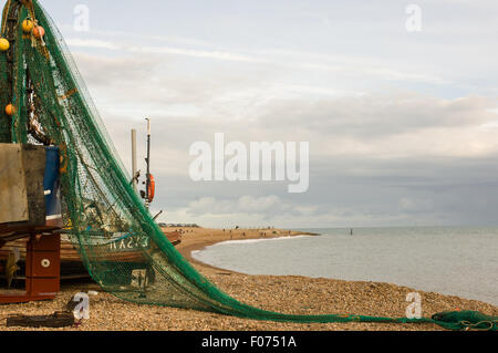 Hastings, East Sussex, England. The fishermen's beach, Rock-a-Nore and green fishing net. Stock Photo