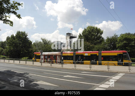 Sunny view, to the museum's Observation Tower, tram at the Warsaw Uprising Museum Light Rail Station, Towarowa Street, Warsaw Stock Photo