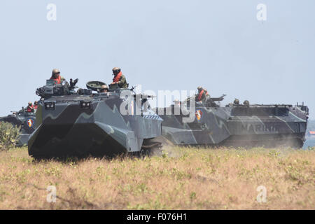 Aug. 8, 2015 - Situbondo, East Java, Indonesia - SITUBONDO, INDONESIA - AUGUST 09: Soldiers of US Marines conduct combat training when the amphibious operation at Banongan Beach on August 08, 2015 in Situbondo, East Java Province, Indonesia. Joint exercises Cooperation Afloat Readiness and Training (CARAT) 2015 followed 676 marines of the Indonesia Navy Marine Corps and US Navy Marines, supported 14 units of amphibious combat vehicle-7 Amphibious Assault Vehicles (AAV-7), 2 units of LCAC USS Germantown, 4 units of LVT-7 and Indonesia War Ship, CARAT aims to increase the professionalism of the  Stock Photo