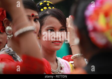 Dhaka, Bangladesh. 9th August, 2015. Bangladeshi indigenous women perform a traditional dance to mark the World Indigenous Peoples Day at the central Shaheed Minar, in Dhaka in 09 August 2015. Over 50 different indigenous societies live in Bangladesh, scattered around country. Among them, their female members are perhaps some of the people most excluded from the rest of society, in terms of education, health care and government resources. This year United Ntions make slogan for ths day is 'Ensuring indigenous peoples' health and well-being'. Credit:  zakir hossain chowdhury zakir/Alamy Live Ne Stock Photo