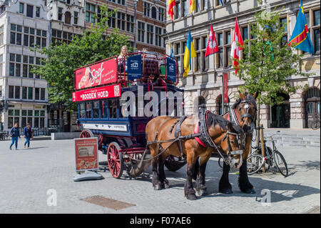 A horse drawn bus being used for tourist rides waiting for more passengers on Suikerrui in historic Antwerp, Belgium Stock Photo