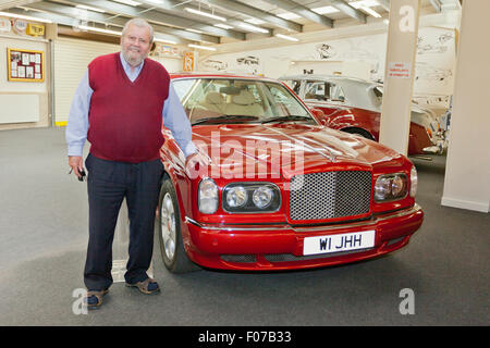 John Haynes founder of the Haynes International Motor Museum, Sparkford, Somerset, England plus Bentley with personalised plate. Stock Photo