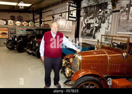 John Haynes founder of the Haynes International Motor Museum, Sparkford, Somerset, England and selection of vintage Morris cars. Stock Photo