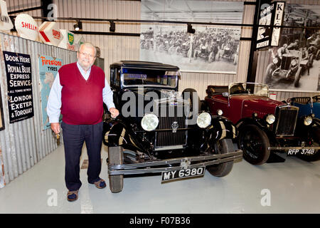 John Haynes founder of the Haynes International Motor Museum, Sparkford, Somerset, England and selection of vintage Morris cars. Stock Photo