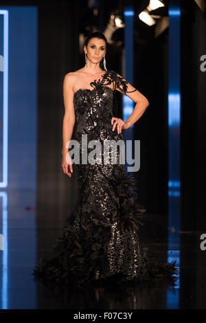 ISTANBUL, TURKEY - NOVEMBER 21, 2014: A model showcases one of the latest creations by Priamos in Fashionist fashion fair