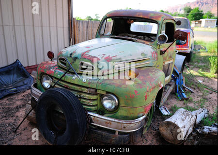 An old Ford Truck sits in a junkyard in America awaiting it's fate. Stock Photo