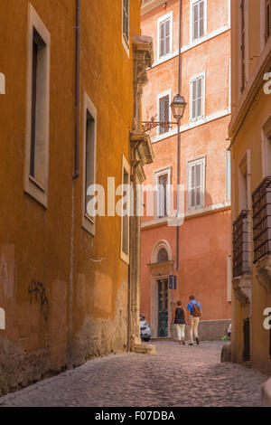 Mature couple Rome, rear view of a middle aged couple walking alone in a street in the historical centre (Centro Storico) of Rome in summer, Italy. Stock Photo