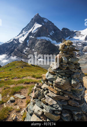 Matterhorn (Cervino) mountain. The north-west ridge, Zmutt ridge. Hiking trail, pyramid of stones. Zermatt. Swiss Alps. Switzerland. Stock Photo