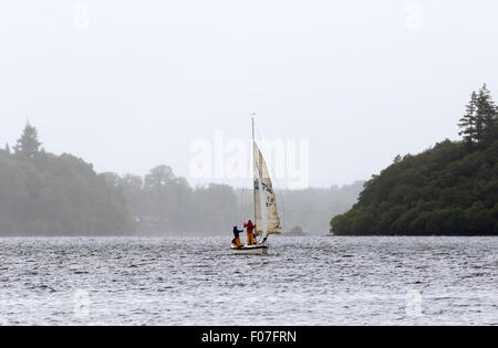 Sailing on a rainy day on Derwentwater, Lake District, Cumbria Stock Photo