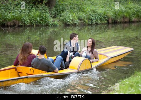 Young people enjoying a day boating on the The River Cherwell in Oxford, Oxfordshire, England, UK