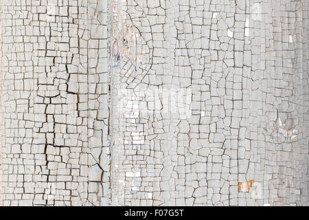 Close-up of a paint peeled off of a wall texture background Stock Photo