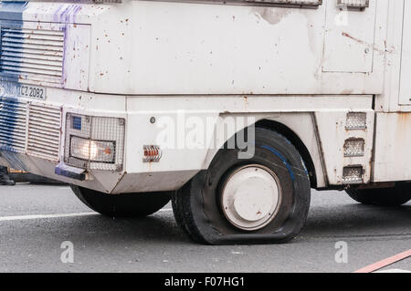 Belfast, Northern Ireland. 09 Aug 2015 - A water cannon suffers damage to its tyre. Credit:  Stephen Barnes/Alamy Live News Stock Photo