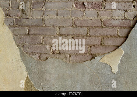Brick and concrete wall texture in shades of yellow and brown. Stock Photo